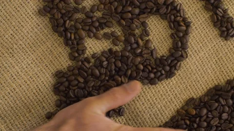 Hand mixing coffee beans Stock Footage 137030095