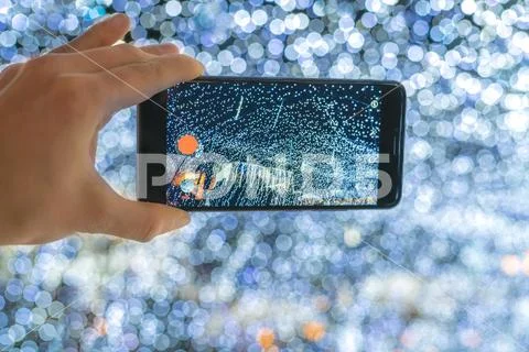 The hand with mobile camera shot lights Stock Photos