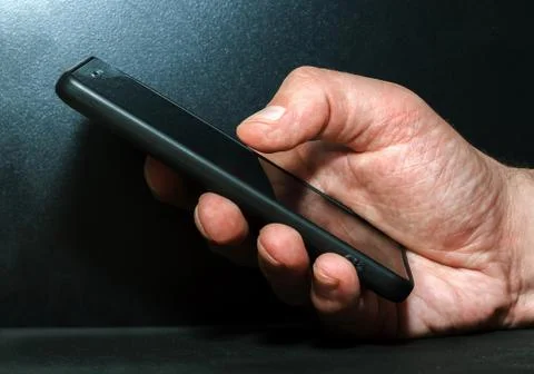 Hand with a mobile phone Stock Photos