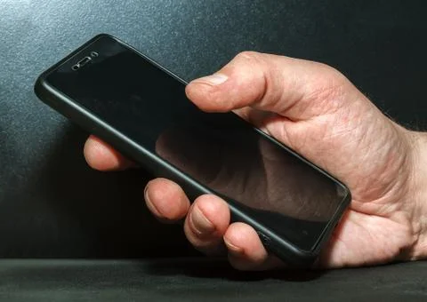 Hand with a mobile phone Stock Photos