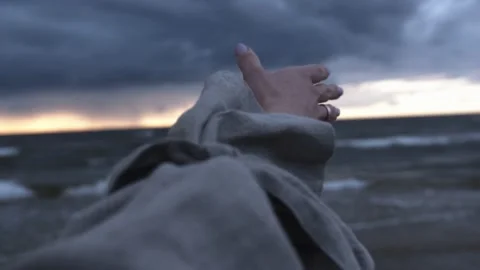 Hand of a model reaching out to sea. Stock Footage 142477353