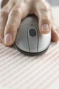 Hand on mouse with binary code Foto stock