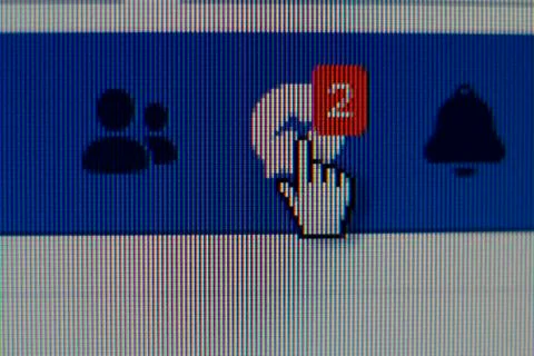 Hand mouse cursor on Facebook messages button Stockfoto's