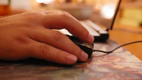 Hand on mouse, man use computer for working. Working with laptop. Close up shot. Stock Footage 119977173
