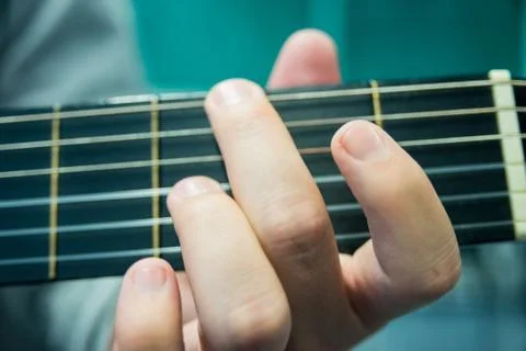 Hand movement while playing a guitar Stock Photos