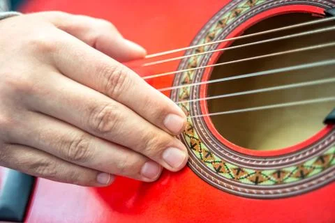 Hand movement while playing a guitar Stock Photos