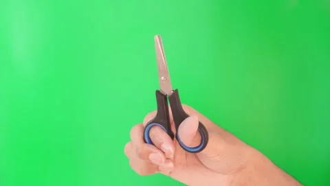 Hand movements performing cutting activities using small scissors. Stock Footage 305685365