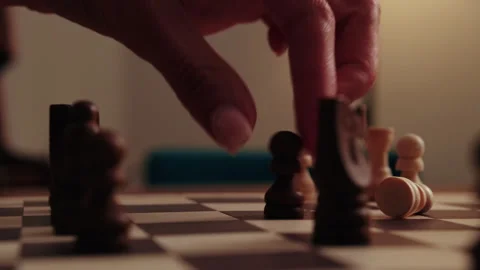 Hand Moves Black Chess Piece, Capturing White Pawn Stock Footage 339599926