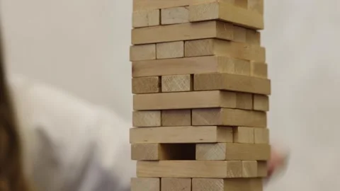 A hand moves a chess piece during a game Stock Footage 278886673