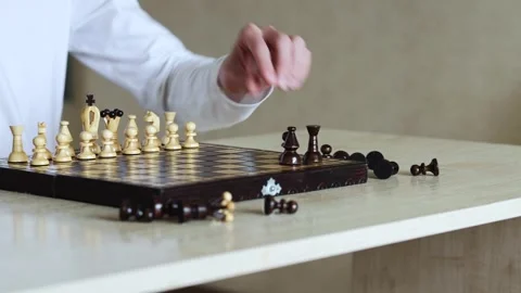 A hand moves a chess piece during a game Stock Footage 278900735