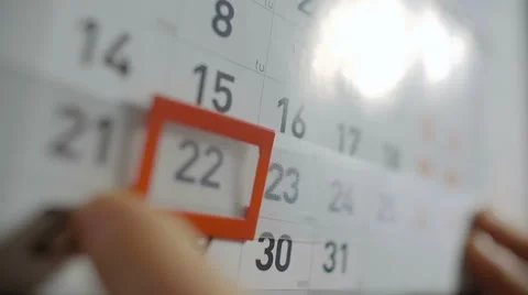 The Hand Moves Date Pointer on Calendar Stock Footage 62740802