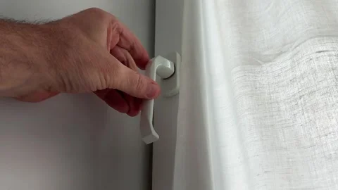 Hand Moves Loose Window Handle Showing Wobbling Lock Mechanism 動画素材 329828044