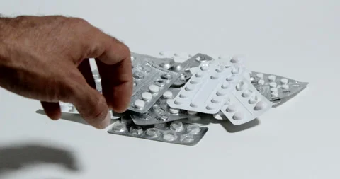 Hand moves to medication holders Stock Footage 197339051