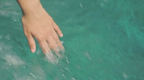 Hand moves through the sea Stock Footage 7749656