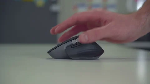 Hand moving and clicking a computer mouse Stock Footage 137786929