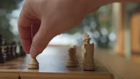 Hand Moving Chess Piece On Board - Close Up Stock Footage 320888644