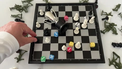 Hand Moving a Chess Piece with Dice, Trophy and Toy Soldiers Stock Footage 341067732