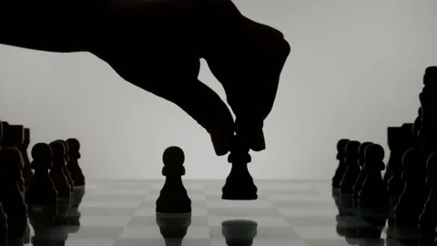 Hand moving chess pieces And Chess Silhouette Stock Footage 243610497
