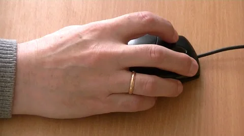 Hand moving computer mouse on the table Stock Footage 58852548
