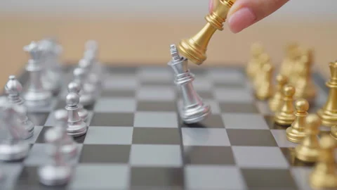 Hand moving gold Chess King figure and Checkmate opponent during chessboard.. Stock Footage 327287016