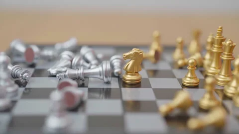 Hand moving gold Chess knight figure and Checkmate opponent during chessboa.. Stock Footage 327287312