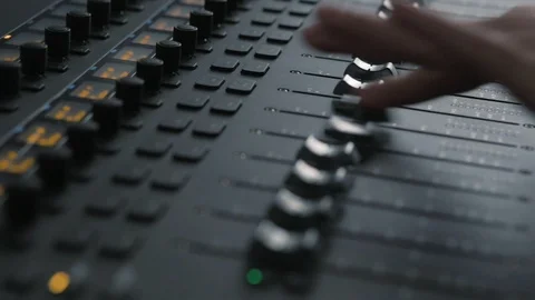 Hand moving the knobs on audio workstation mixer console for sound production 스톡 동영상 89816866