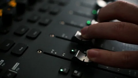 Hand moving the knobs of digital audio console workstation Stock Footage 89778290
