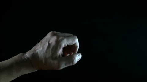 Hand moving with light on black background Stock Footage 234165276