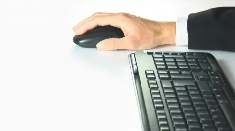 Hand moving mouse with keyboard Stock Footage 87501