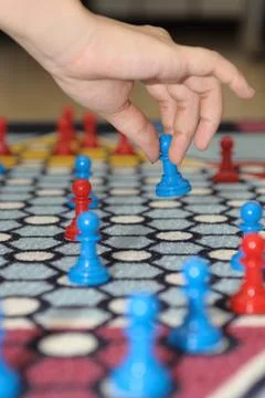 Hand moving piece Stock Photos