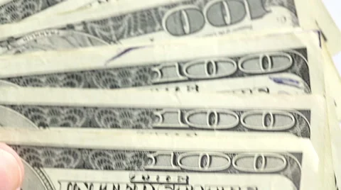 Hand moving through 100 dollar bills slowly Stock Footage 42244503