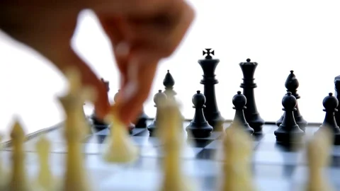 Hand moving white pawn piece on classic chess board Video stock 332284734