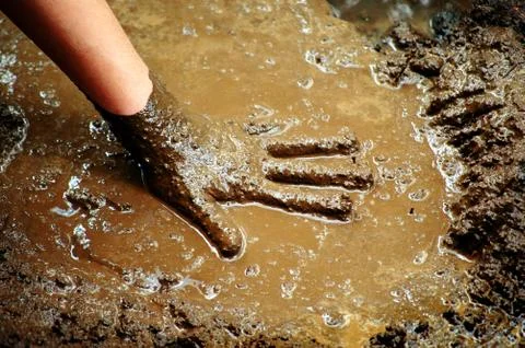 Hand in Mud Stock Photos