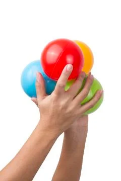 Hand with multicolored Balls Stock Photos