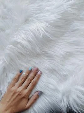 Hand with nails of different colors on white background with a place for text Stock Photos