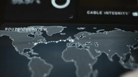 Hand navigates a technical world map showing illuminated transoceanic cable Stock Photos