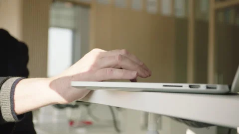 Hand navigating desktop computer in an office environment Stock Footage 251224741