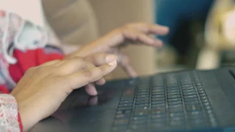 Hand Navigating Laptop Touchpad and Keyboard  Office Workflow Stock Footage 325528804