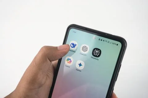 Hand Navigating Smartphone Apps Featuring AI-Themed Icons. Such as Deepseek.. Stock Photos