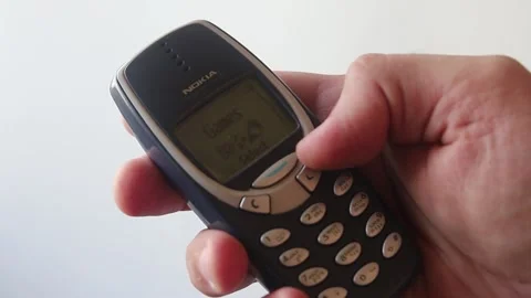 Hand Is Navigating Through Menu Of An Obsolete Nokia 3310  Mobile Phone Stock Footage 158318200