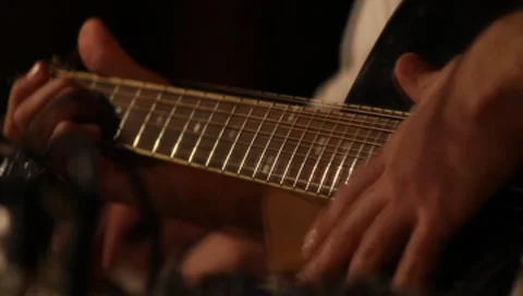 Hand on the neck of the guitar close up Stock-Footage 7748846
