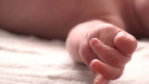 The hand of a newborn Video stock 94225376