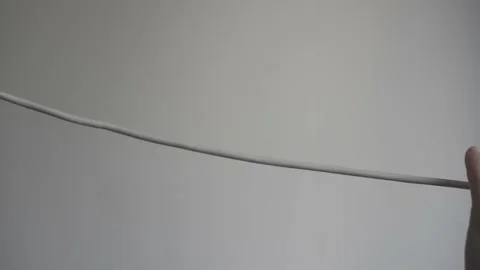 Hand with nippers about to cut the cable 스톡 동영상 156614952