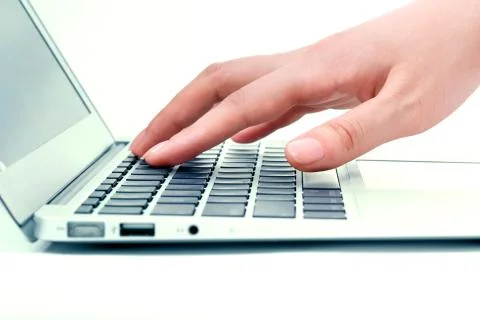 Hand in the notebook computer Stock Photos