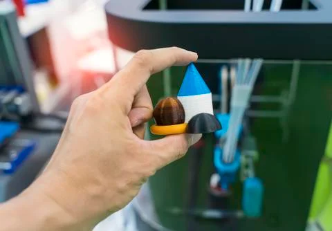 Hand with Object printed on 3d printer close-up. Stock Photos