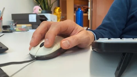 The hand of an office worker at a desk Stock Footage 123440432