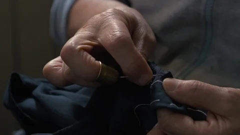 Hand of old female tailor Stock Footage 76126315