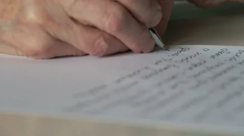 Hand of old woman writing letter Stock Footage