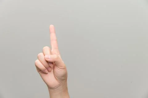 Hand with one finger up Stock Photos