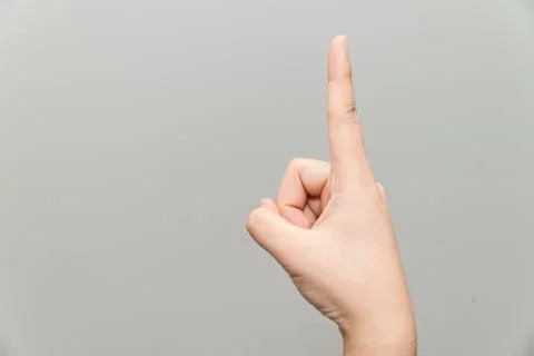 Hand with one finger up Stock Photos